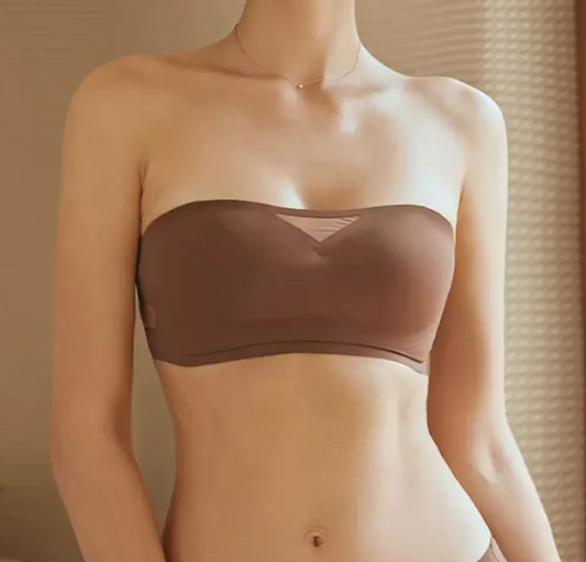 Brown strapless bra from The Seventh  worn by a woman  against a neutral background