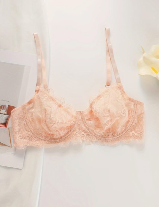 An underwire push up peach bra by The Seventh Muse on a white background
