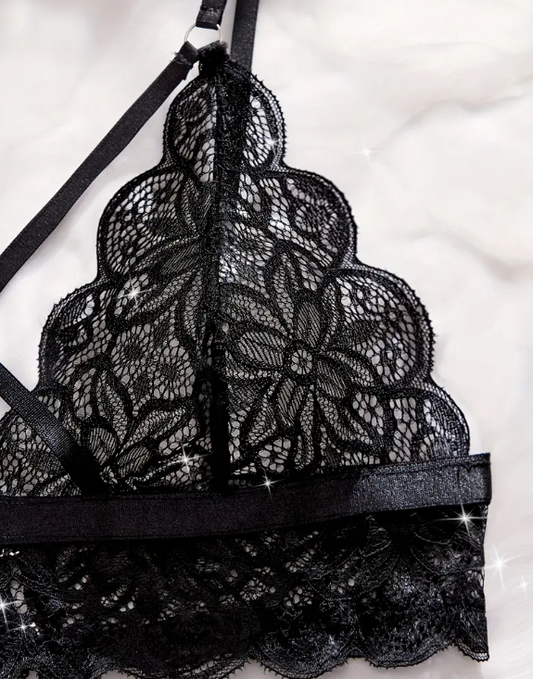 Black lace bra by The Seventh Muse on a white background