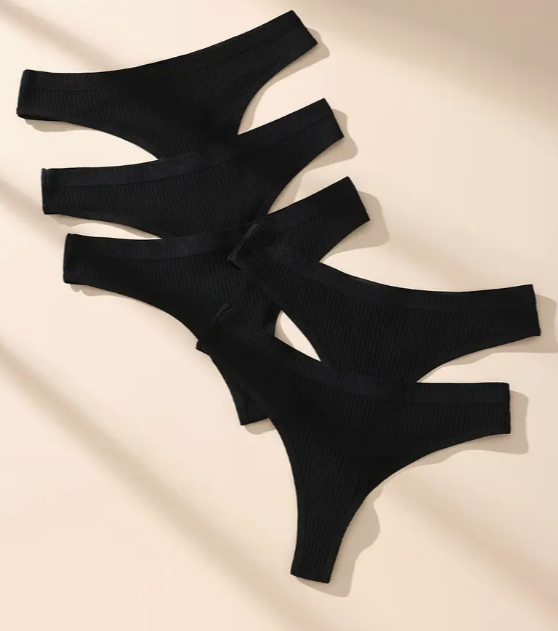 Set of five black seamless ribbed thong panties.