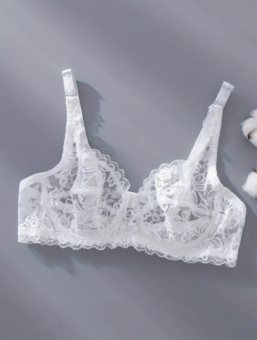 White lace bra on a gray background by The Seventh Muse