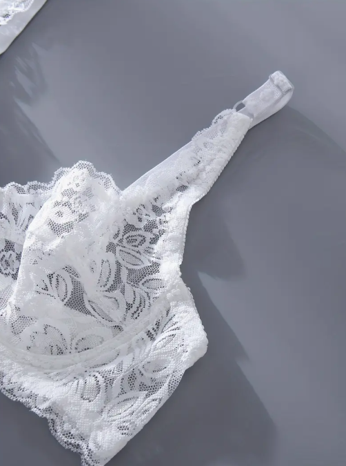 White lace lingerie set on a gray background by The Seventh Muse