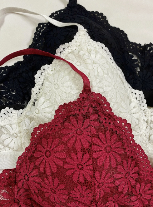 Close up of the set of floral lace bralette and matching panties in maroon, white, and black – stylish padded intimate wear by The Seventh Muse