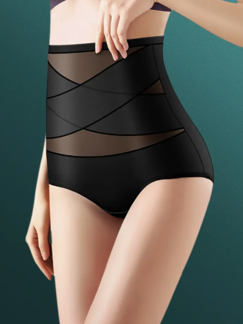 Black control brief featuring a high waist, sheer mesh construction, and X-band panels for firm tummy smoothing and shaping.