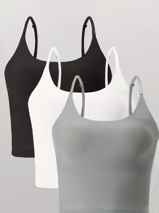 Three sports tank top/camisole in black, white, and gray on a light gray background