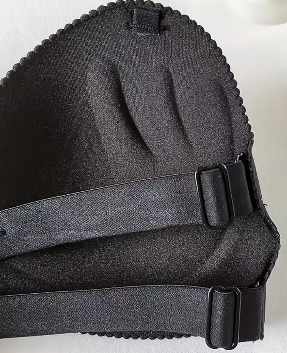 Model wearing a smooth, black contour strapless bra with a sweetheart neckline, suitable for fitted and off-shoulder dresses