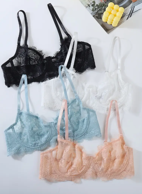 Four unwire push up lace bras by The Seventh Muse in black, blue, white and peach on a white background