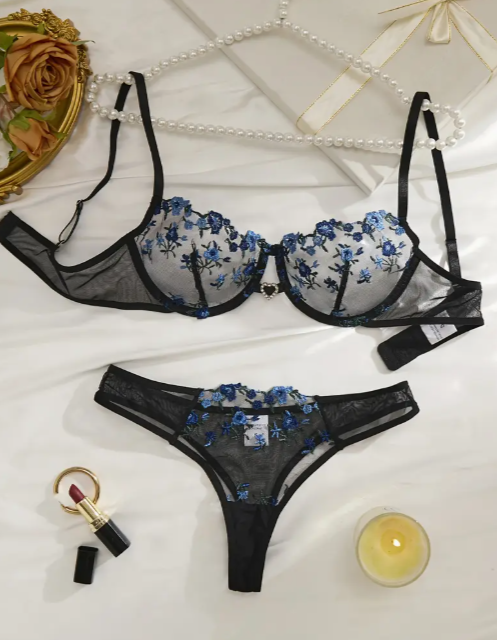 Black semi-sheer embroidered lace lingerie set featuring a soft lace bra with floral detailing and a matching lace panties