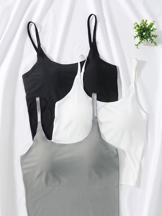 Black, White and gray tank tops on a white background