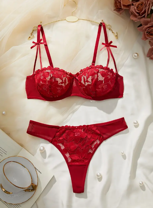 Red lace bra and thong set from The Seventh Muse with small bow details on the straps, and full floral embroidery.