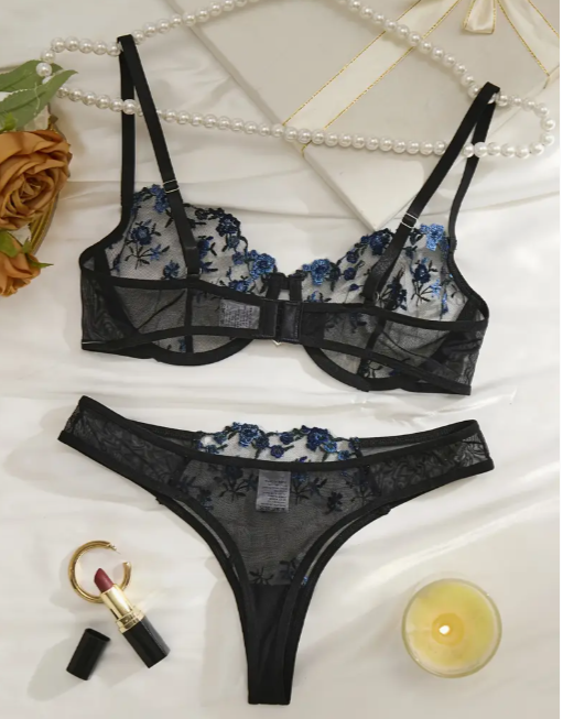 A black and blue floral lace lingerie set with unlined cups, adjustable straps, and delicate embroidery by The Seventh Muse