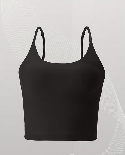 Black tank top with thin straps on a light gray background