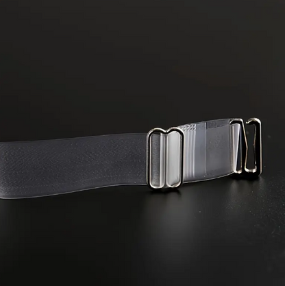 Close-up of two adjustable, transparent clear bra straps with silver-toned metal clasps and adjusters on a dark background.